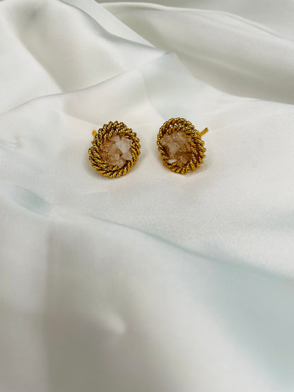 Round shaped studs embellished with White crushed stones to compliment with your both eastern and western look.