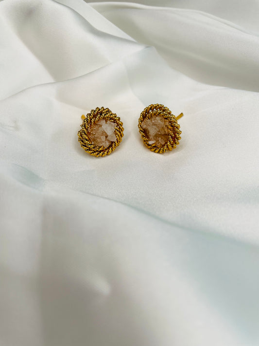 Round shaped studs embellished with White crushed stones to compliment with your both eastern and western look.